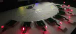 Efficient Distributed Wireless Power Transfer System for Multiple Wearable Sensors Through Textile Coil Array